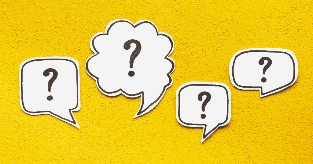 黄色い背景に浮かぶ複数のクエスチョンマーク